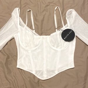WHITE FOX, size medium, white long sleeve corset top with tags.